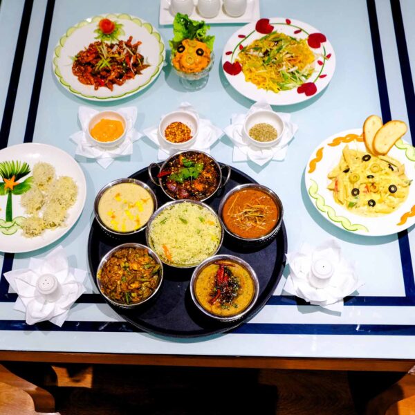 Cozy setting with travelers enjoying a traditional meal.